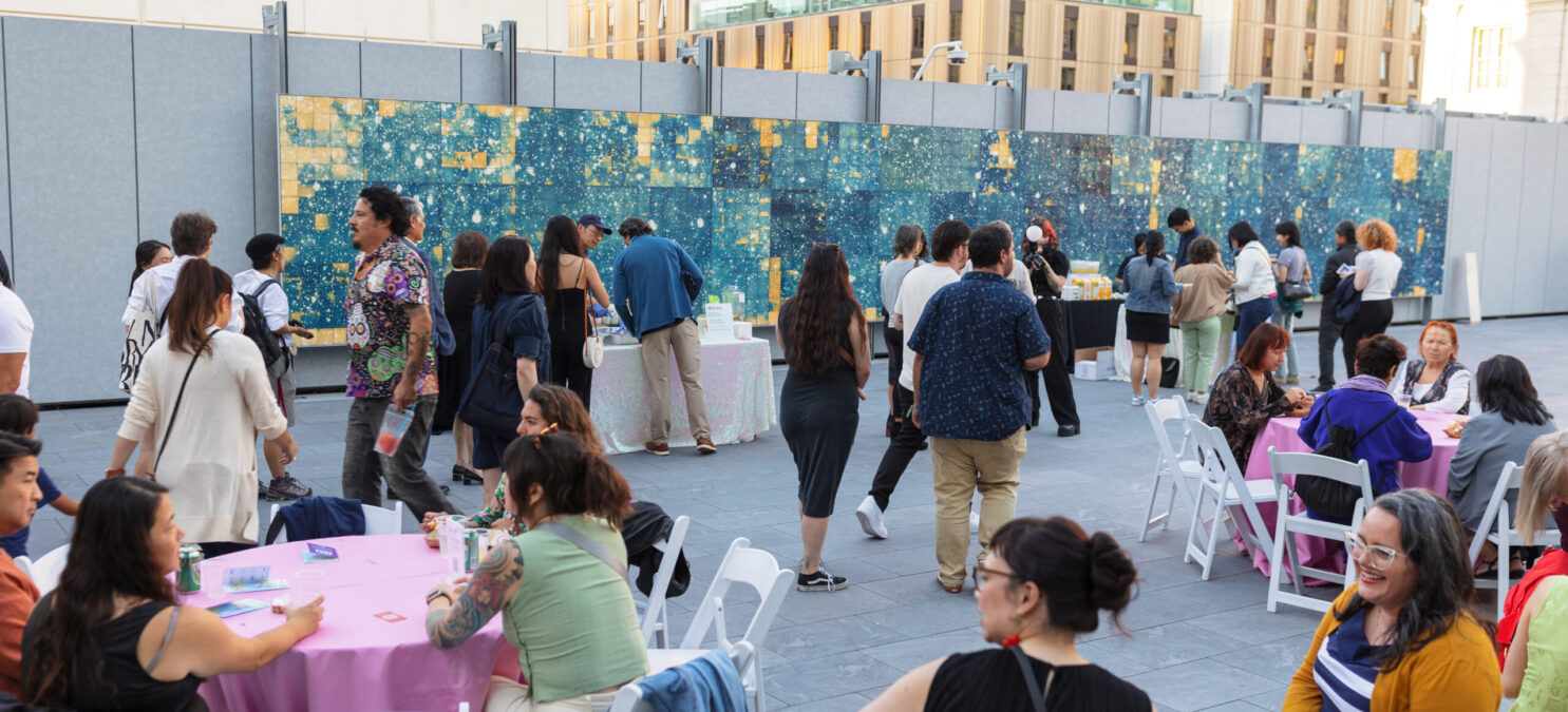 A photo of members enjoying a reception on the East West Bank Art Terrace at the Asian Art Museum.